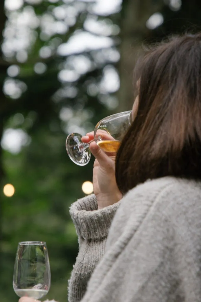 A lady sampling whisky during a tasting session.